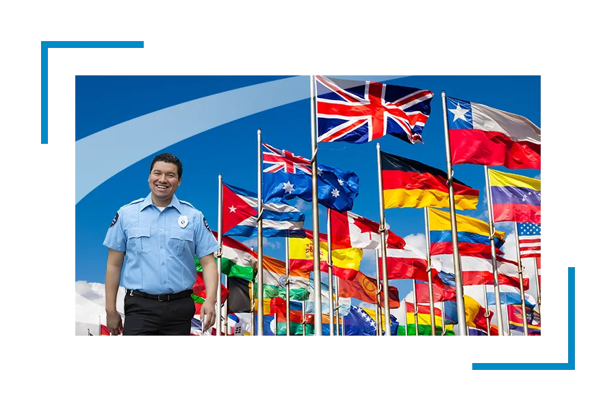 Security guard in front of national flags