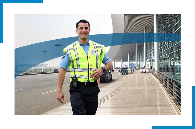 A uniformed security guard salking in a bus station