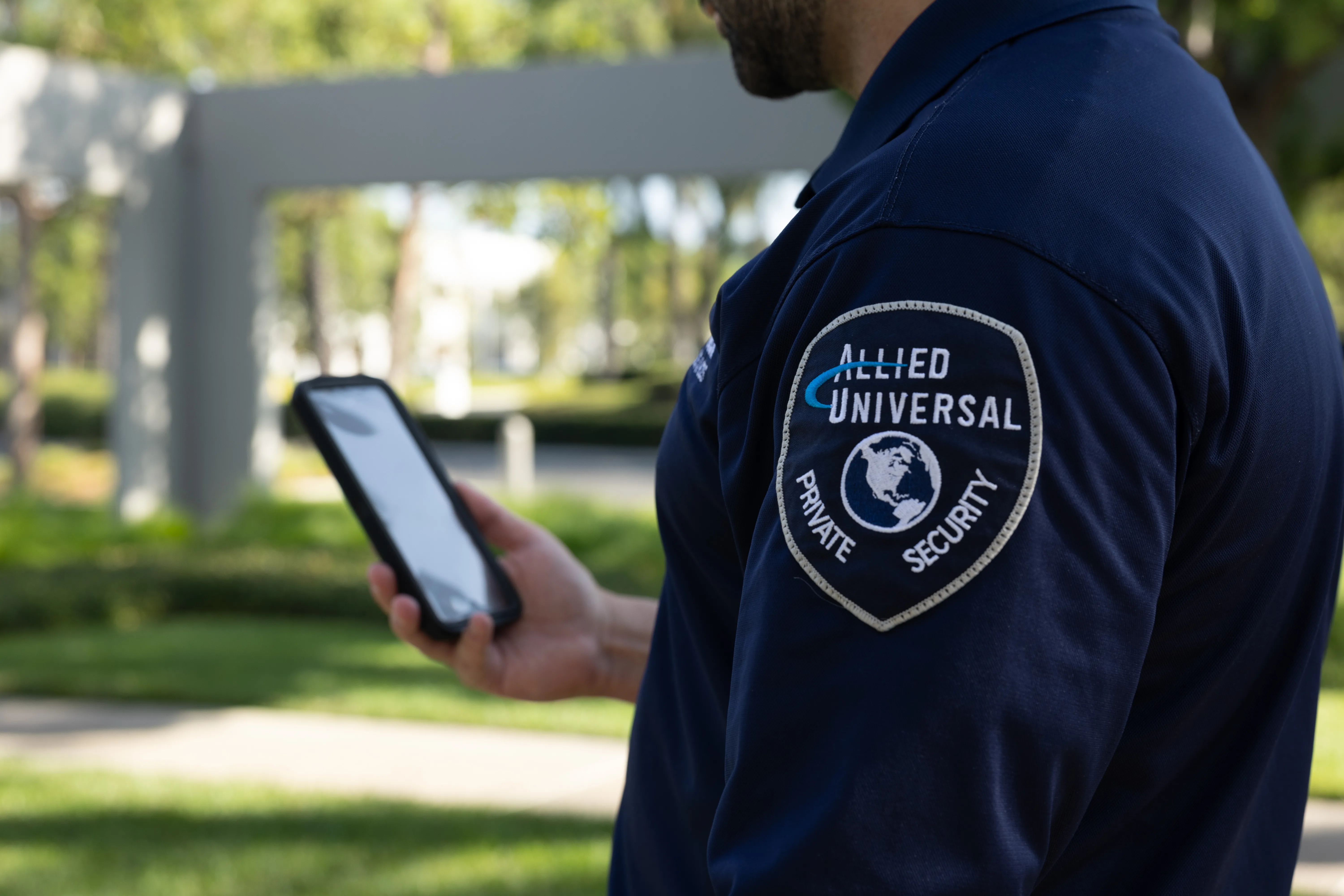 allied universal uniform with badge