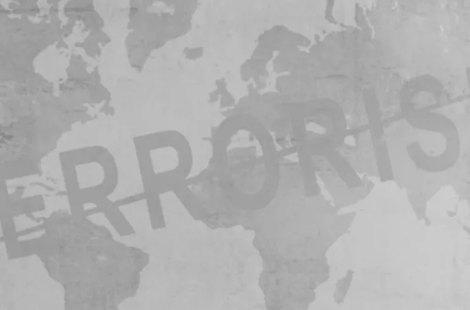 Gray world map with bold typography reading “TERRORISM” diagonally across it, representing the global impact of terrorism and security awareness.