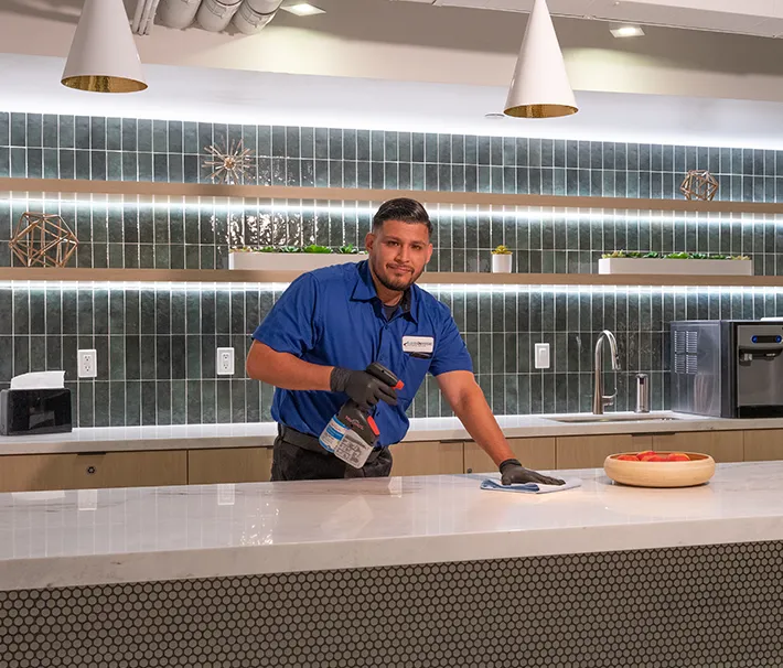 man cleaning counter, janitorial services