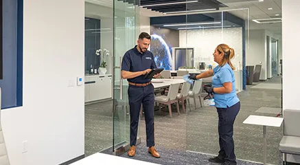 man and woman in office - janitorial services