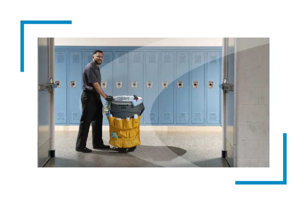 man walking with trash can past school lockers