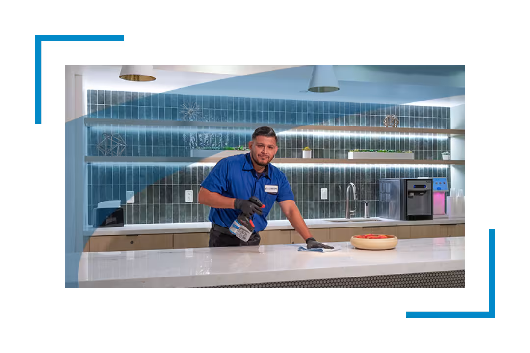 man cleaning counter