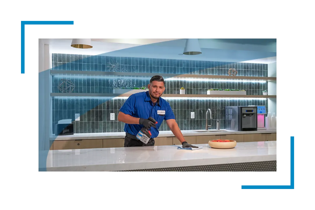 man cleaning counter