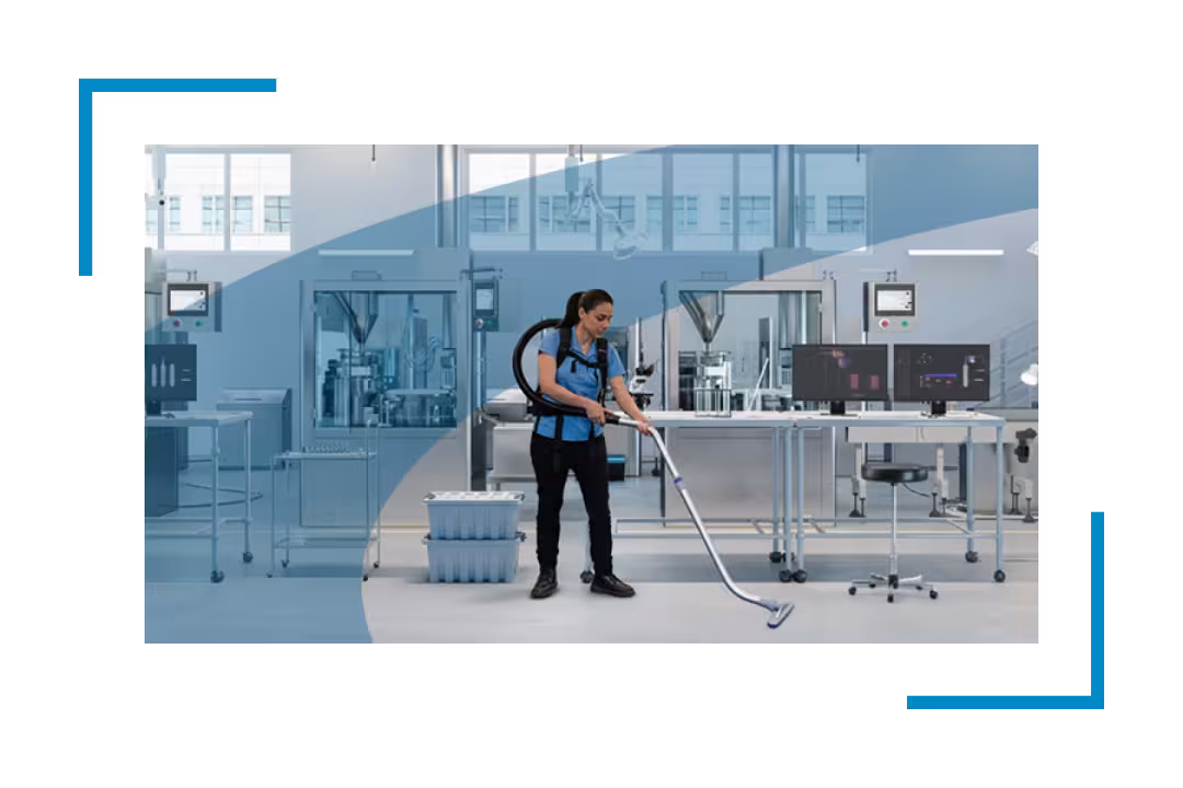 woman vacuuming pharmaceutical plant