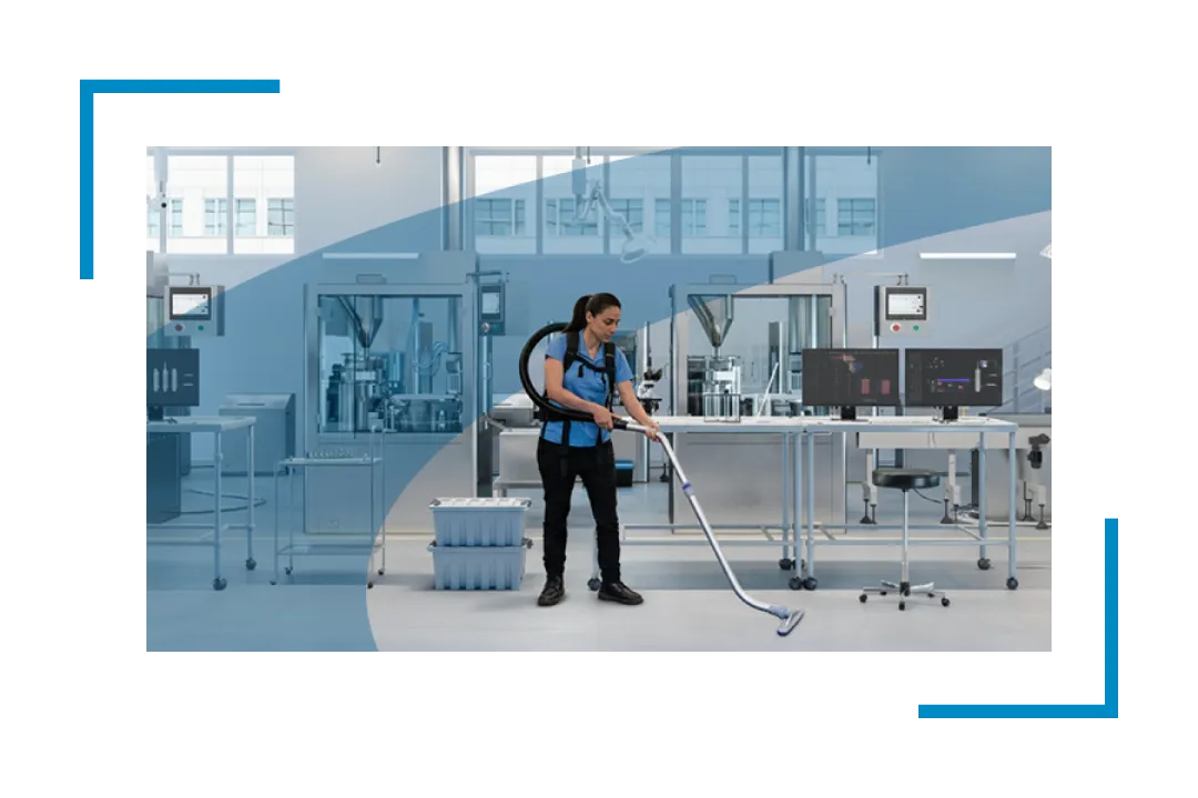 woman vacuuming pharmaceutical plant