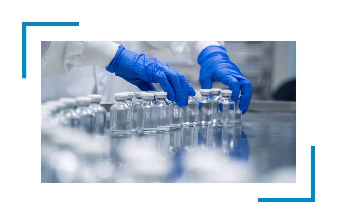 hands in blue gloves handling empty bottles, janitorial services