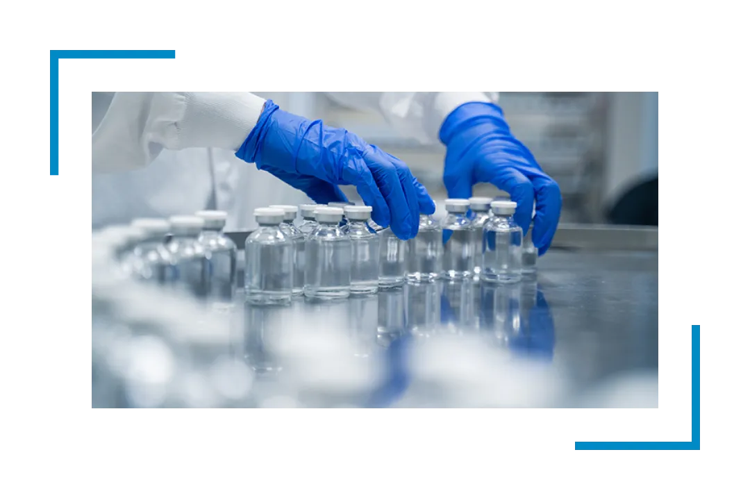 hands in blue gloves handling empty bottles, janitorial services