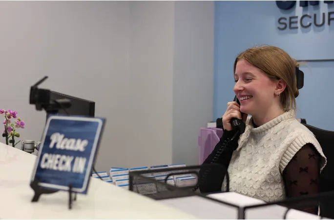 Women talking in phone smiling