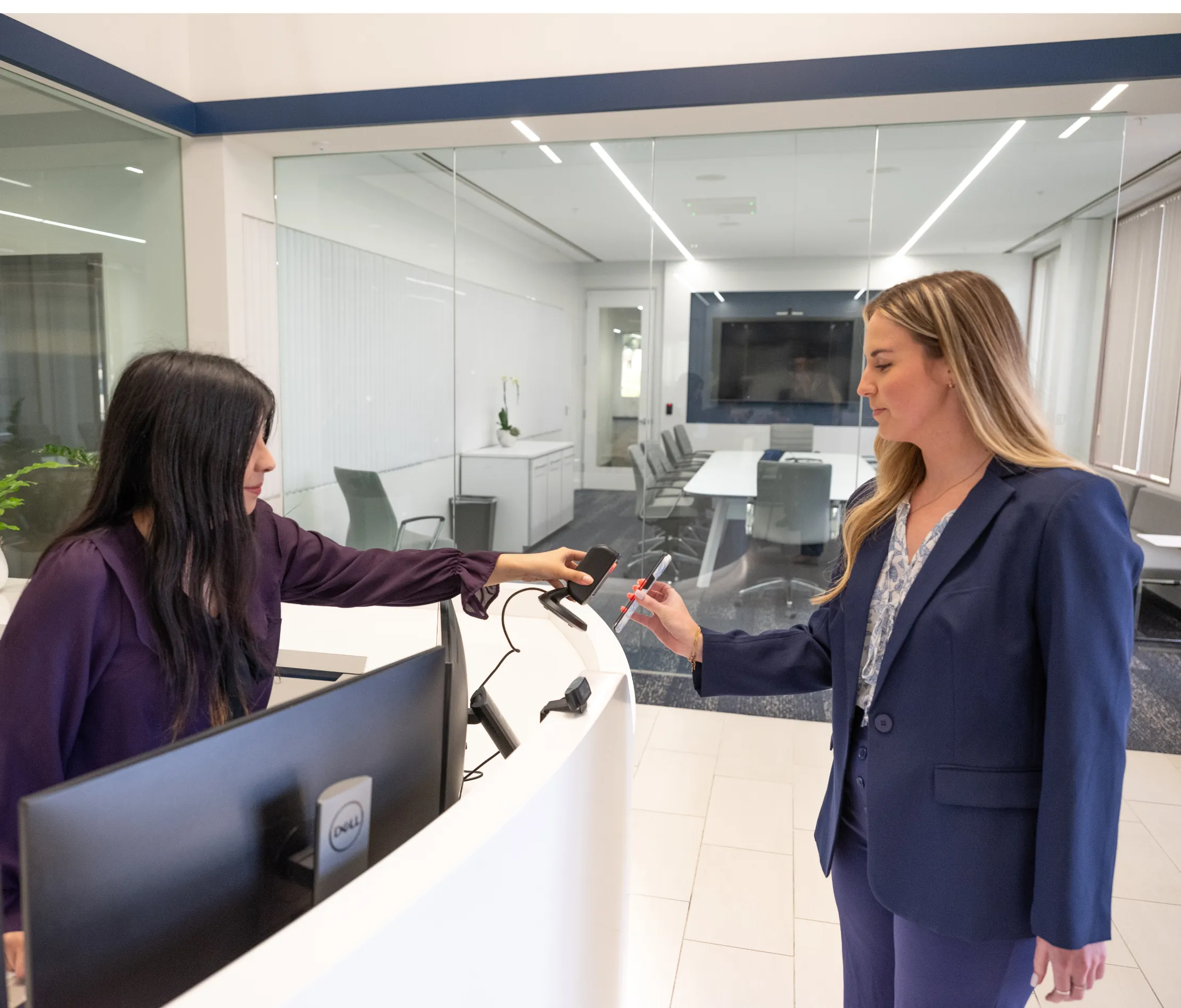 women trying to get into a building by scanning ID